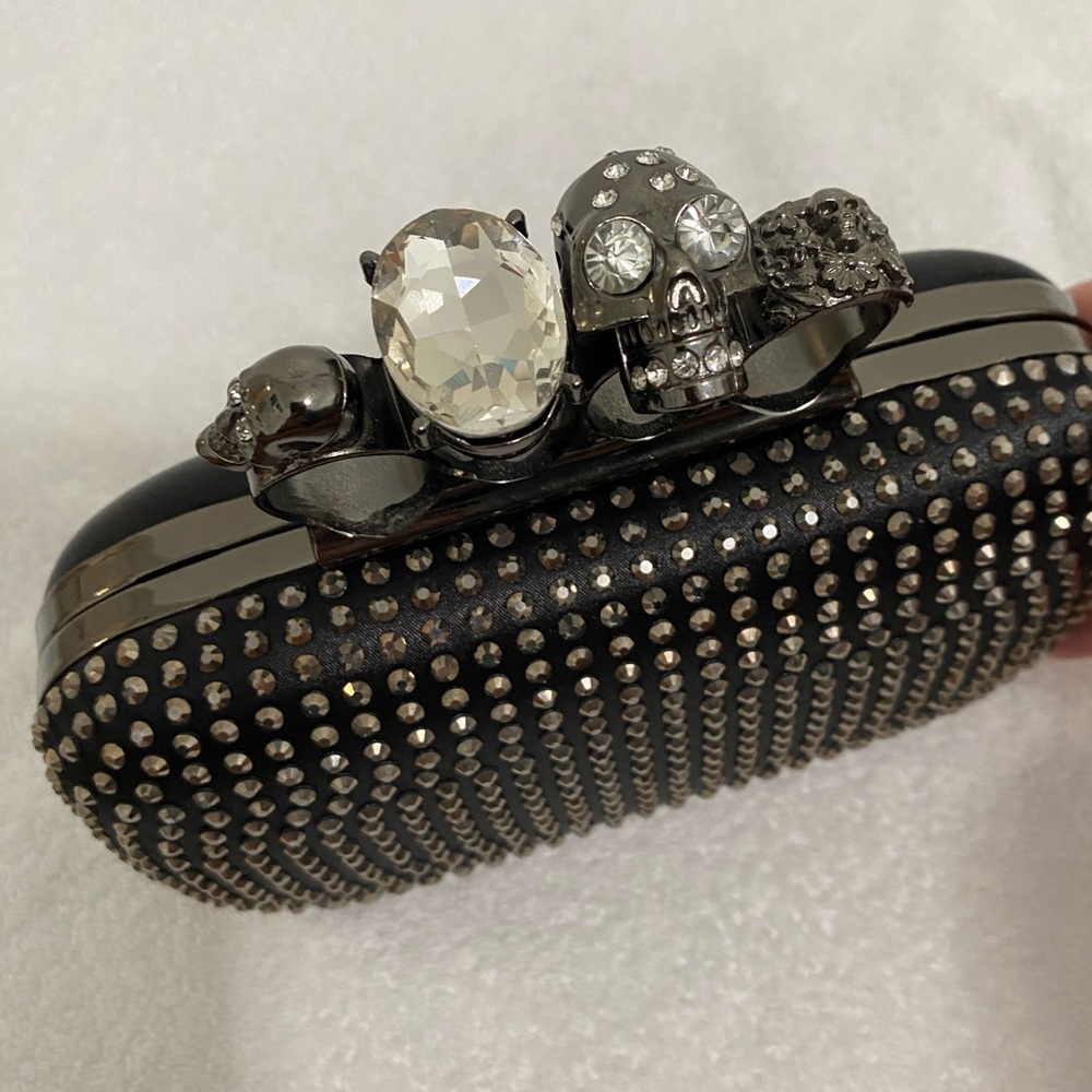 Skull Ring Knuckle Clutch with Chain Strap
McQueen inspired studded design